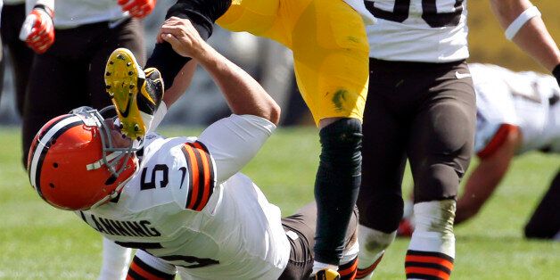 Pittsburgh Steelers Antonio Brown (84) kicks Cleveland Browns punter Spencer Lanning (5) as he jumps while returning a punt in the second quarter of the NFL football game on Sunday, Sept. 7, 2014, in Pittsburgh. Brown was penalized for unnecessary roughness on the play. (AP Photo/Gene J. Puskar)