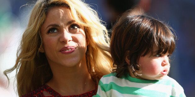 RIO DE JANEIRO, BRAZIL - JULY 13: Singer Shakira and son Milan Pique look on during the closing ceremony prior to the 2014 FIFA World Cup Brazil Final match between Germany and Argentina at Maracana on July 13, 2014 in Rio de Janeiro, Brazil. (Photo by Julian Finney/Getty Images)