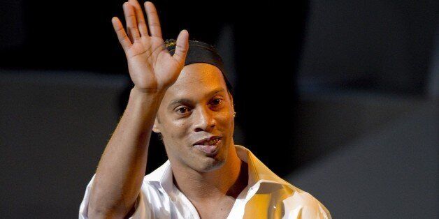 Brazilian footballer Ronaldinho waves before a conference at the National Auditorium in Mexico city, on September 5, 2014 in the framework of Telmex foundation's 'Mexico Siglo XXI' forum, owned by Mexican tycoon Carlos Slim. AFP PHOTO/ALFREDO ESTRELLA (Photo credit should read ALFREDO ESTRELLA/AFP/Getty Images)