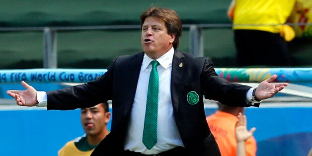 Mexico's head coach Miguel Herrera gestures during the World Cup round of 16 soccer match between the Netherlands and Mexico at the Arena Castelao in Fortaleza, Brazil, Sunday, June 29, 2014. (AP Photo/Wong Maye-E)
