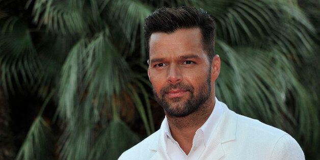 Puerto Rican singer Ricky Martin poses as he arrives for the World Music Awards in Monaco, Tuesday, May 27, 2014. The awards are presented to the world's best-selling artists in various categories and to the best-selling artists from each major territory. (AP Photo/Bruno Bebert)