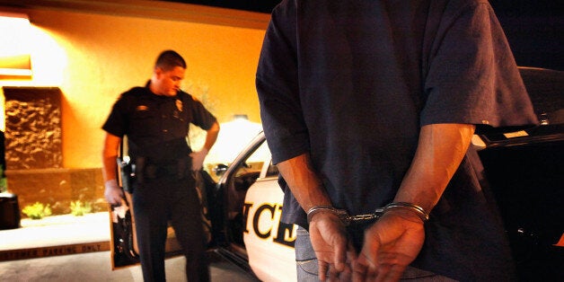 TUCSON, AZ - MAY 29: Tucson Police Officer Angel Ramirez arrests a man for trespassing May 29, 2010 in Tucson, Arizona. Ramirez works in the city's predominately Hispanic south side. The Tucson Police Department is currently gearing up to begin training its officers on the implementation of the controversial new immigration law SB 1070. Although a Tucson police officer was one of the first to file suit in federal court challenging the new law, most rank and file officers tend to support the legislation while the Arizona Chiefs of Police have criticized it. (Photo by Scott Olson/Getty Images)