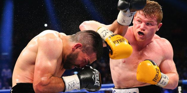 LAS VEGAS, NV - MARCH 8: Saul 'Canelo' Alvarez (yellow/black trunks) and Alfredo Angulo (black/silver trunks) during their super welterweight fight at the MGM Grand Garden Arena on March 8, 2014 in Las Vegas, Nevada. (Photo by Ed Mulholland/Golden Boy/Golden Boy via Getty Images)