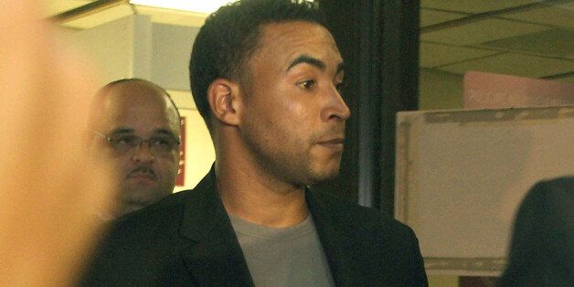 SAN JUAN, PUERTO RICO - SEPTEMBER 17: Reggaeton artist Don Omar leaves the Policia Comandancia Area - Bayamon after being arrested for suspicion of domestic violence, for allegedly threatening his girlfriend, Rebecca Lopez, on September 17, 2014 in San Juan, Puerto Rico. (Photo by GV Cruz/WireImage)