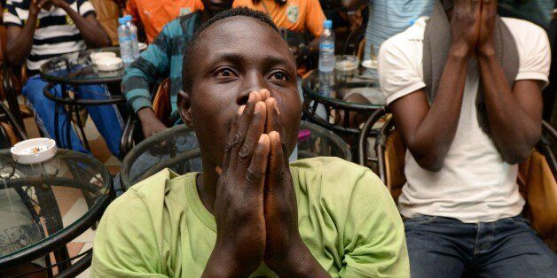 Ivorian migrants react during the FIFA World Cup 2014 football match between Ivory Coast and Colombia in Brazil, on June 19, 2014 in Rabat, Morocco. AFP PHOTO / FADEL SENNA (Photo credit should read FADEL SENNA/AFP/Getty Images)