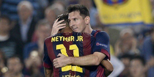 Barcelona's Argentinian forward Lionel Messi (R) is congratulated by his teammate Brazilian forward Neymar da Silva Santos Junior after scoring during the UEFA Champions League football match FC Barcelona vs Ajax Amsterdam at the Camp Nou stadium in Barcelona on October 21, 2014. AFP PHOTO/ JOSEP LAGO (Photo credit should read JOSEP LAGO/AFP/Getty Images)