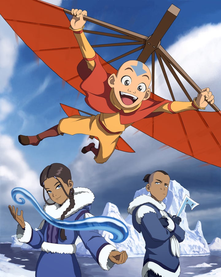 Aang flies from his airbender staff as Katara and Sokka pose below in the original “Avatar: The Last Airbender.”