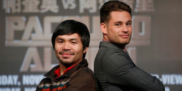 WBO Welterweight champion Manny Pacquiao, left, of the Philippines, and WBO junior welterweight champion Chris Algieri of United States, right, pose for photographers during a news conference in Macau, Monday, Aug. 25, 2014. The boxers are scheduled to battle in WBO welterweight title match at The Venetian Macao on Nov. 23 in Macau. (AP Photo/Vincent Yu)