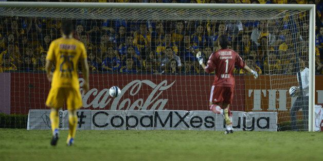 MONTERREY, MEXICO - OCTOBER 29: Nahuel Guzman goalkeeper of Tigres watches as the ball gets in his goal during a semifinal match between Tigres UANL and Santos Laguna as part of Copa MX Apertura 2014 at Universitario Stadium on October 29, 2014 in Monterrey, Mexico. (Photo by Mario Ocampo/LatinContent/Getty Images)