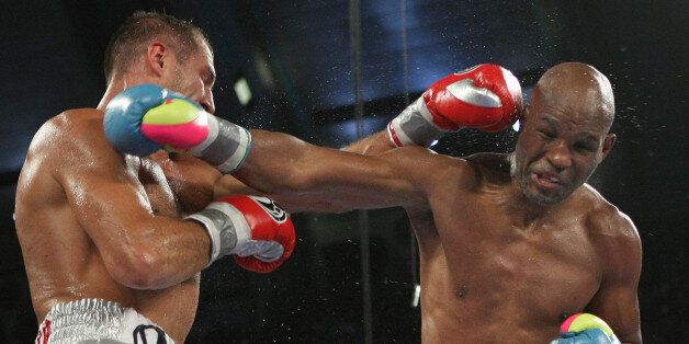 Bernard Hopkins of Philadelphia, PA, right, and Sergey Kovalev of Russia exchange punches during the sixth round of the Main Event IBF, WBA and WBO Light Heavyweight Titles boxing in Atlantic City, N.J. on Saturday, Nov. 8, 2014. Kovalev won by TKO in the 12th round. (AP Photo/Tim Larsen)