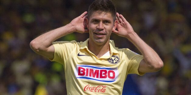 TOLUCA, MEXICO - NOVEMBER 09: Oribe Peralta of America celebrates after scoring the second goal against Toluca during a match between Toluca and America as part of 16th round Apertura 2014 Liga MX at Nemesio Diez Stadium on November 09, 2014 in Toluca, Mexico. (Photo by Adid Jimenez/LatinContent/Getty Images)