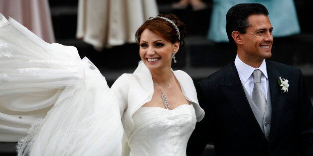Enrique Pena Nieto, Mexico State's Governor, right, and Mexican actress Angelica Rivera smile after their wedding outside the Metropolitan Cathedral in Toluca, Mexico, Saturday, Nov. 27, 2010. (AP Photo/Marco Ugarte)