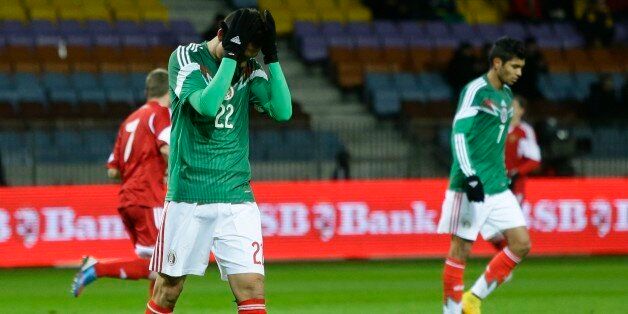 Mexico's Paul Aguilar reacts during their international friendly soccer match against Belarus at Borisov-Arena stadium in Borisov, Belarus, Tuesday, Nov. 18, 2014. (AP Photo/Sergei Grits)