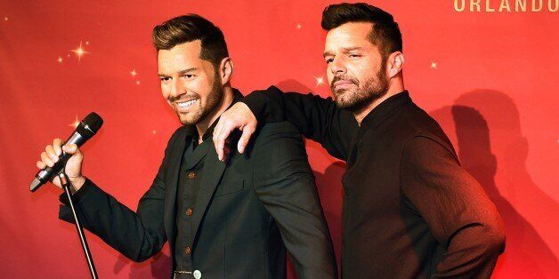 Superstar Ricky Martin (R) unveils his wax figure at Madame Tussauds Las Vegas on the eve of the Latin Grammy awards in Las Vegas, Nevada on November 19, 2014. AFP PHOTO/Mark RALSTON (Photo credit should read MARK RALSTON/AFP/Getty Images)