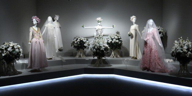 Wedding gowns are pictured at the exhibition titled 'Hubert de Givenchy' at the Thyssen-Bornemisza museum in Madrid on October 20, 2014. This exhibition, the first major retrospective to be devoted to French fashion designer Hubert de Givenchy and the Museums first incursion into the world of fashion, will present a selection of his finest creations. It will run from October 22, 2014 to January 18, 2015. AFP PHOTO/ GERARD JULIEN (Photo credit should read GERARD JULIEN/AFP/Getty Images)
