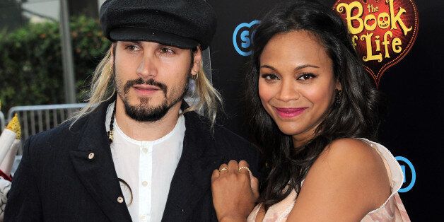 LOS ANGELES, CA - OCTOBER 12: Actress Zoe Saldana and husband Marco Perego arrive for the Premiere Of Twentieth Century Fox And Reel FX Animation Studios' 'The Book Of Life' held at Regal Cinemas L.A. Live on October 12, 2014 in Los Angeles, California. (Photo by Albert L. Ortega/Getty Images)