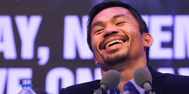 MACAU - NOVEMBER 23: Manny Pacquiao of the Philippines speaks to media at the post fight press conference after winning against Chris Algieri of the United States during the WBO world welterweight title at The Venetian on November 23, 2014 in Macau, Macau. (Photo by Chris Hyde/Getty Images)