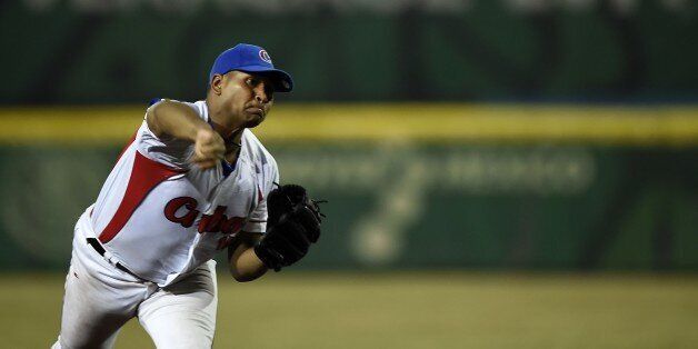 Pitcher Freddy Aciel Alvarez from Cuba pitches against Nicaragua during the final match of Baseball, at the XXII Central American and Caribbean Games, in Veracruz, Mexico, on November 21, 2014. The Games bring together nearly 8,000 athletes from 31 countries and run through November 30. AFP PHOTO/RONALDO SCHEMIDT (Photo credit should read RONALDO SCHEMIDT/AFP/Getty Images)