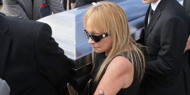 SAN JUAN, PUERTO RICO - DECEMBER 05: Yolandita Monge attends the funeral services for her husband Carlos 'Topy' Mamery on December 5, 2014 in San Juan, Puerto Rico. (Photo by GV Cruz/WireImage)