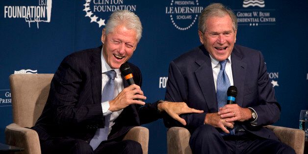 Former Presidents Bill Clinton, left, and George W. Bush, laugh while participating in the Presidential Leadership Scholars Program Launch, Monday, Sept. 8, 2014, at The Newseum in Washington. The two are launching a new scholars program at four presidential libraries, aiming to help academics and business leaders learn more about presidential leadership. (AP Photo/Jacquelyn Martin)