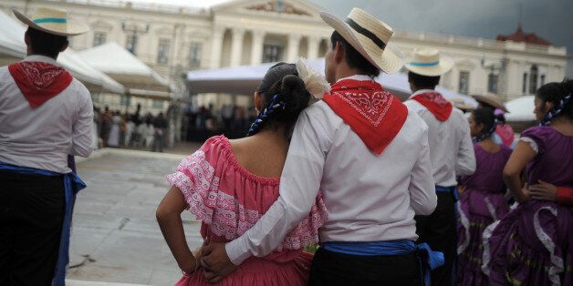 High school students wearing traditional Salvadorean clothes participate in the inauguration ceremony of the month of the Central American independence, in downtown San Salvador, on September 2, 2013. The Salvadorean government inaugurated the celebrations of the 192th anniversary of the Central American independece from Spain, declared on September 15, 1821. AFP PHOTO/ Jose CABEZAS (Photo credit should read Jose CABEZAS/AFP/Getty Images)