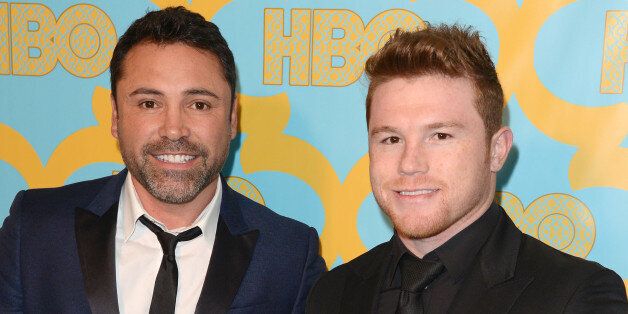 LOS ANGELES, CA - JANUARY 11: Golden Boy Promotions Founder and President Oscar De La Hoya (L) and professional boxer Canelo Alvarez attend HBO's Official Golden Globe Awards After Party at The Beverly Hilton Hotel on January 11, 2015 in Beverly Hills, California. (Photo by C Flanigan/Getty Images)