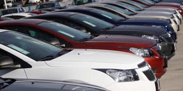 In this file photograph taken on Sunday, Jan. 20, 2013, unsold 2013 Cruze sedans sit at a Chevrolet dealership in Englewood, Colo. (AP Photo/David Zalubowski)