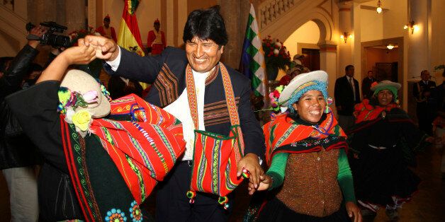 LA PAZ, BOLIVIA - SEPTEMBER 28: President Evo Morales dances with Kallawaya ladies after a ceremony by Kallawaya indigenous healers in the Presidential Palace. Ceremony was held to help him take decisions over the recent TIPNIS crisis and ensure a positive outcome for Bolivia. It was also partly to show he still has support of indigneous groups for his policies to reform Bolivia after another day of protests and criticism of his government's handling of the TIPNIS issue, September 28, 2011 - La Paz, Bolivia. (Photo by James Brunker/Latin Content/Getty Images)