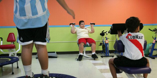 Puerto Rican boys exercise at a gym specialized in children's fitness in Guaynabo, Puerto Rico, April 20, 2007. Statistics point to a growing generation of Puerto Rican children struggling with obesity and related diseases, once rarely seen among such young people. The problem is worse here than on the U.S. mainland: Studies show 26 percent of youngsters are obese, compared to 18 percent on the U.S. mainland. (AP Photo/Brennan Linsley)
