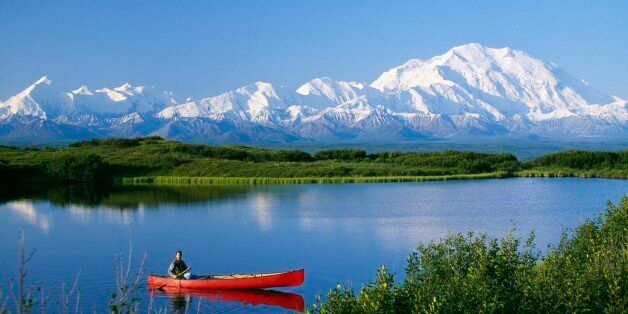 Canoeist on lake, Mount McKinley, Denali National Park, Alaska, USA.