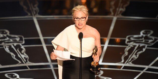 Winner for Best Supporting Actress Patricia Arquette accepts her award on stage at the 87th Oscars February 22, 2015 in Hollywood, California. AFP PHOTO / Robyn BECK (Photo credit should read ROBYN BECK/AFP/Getty Images)