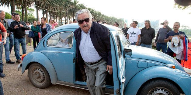 Uruguay's President Jose Mujica arrives to cast his vote in Montevideo, Uruguay Sunday, Oct. 26, 2014. Uruguayâs presidential election is set to go into a runoff as undecided voters could opt for change on Sunday, despite an economic boom and social reforms led by the ruling Broad Front coalition. (AP Photo/Natacha Pisarenko)