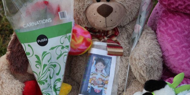 A memorial of stuffed teddy bears and flowers are seen on Monday, March 23, 2015, near the home where Ahizya Osceola, 3, was found dead in Hollywood, Fla. Ahizya's 3-foot-6, 40-pound body was found last Thursday in an 'obscure' place within the house on Johnson Street, Hollywood police chief Frank Fernandez said. (Amy Beth Bennett/Sun Sentinel/TNS via Getty Images)