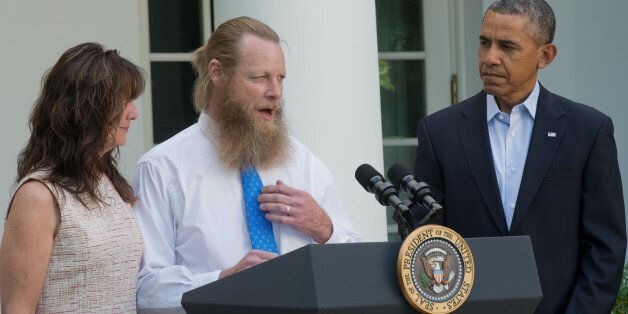 WASHINGTON, DC - MAY 31: Bob Bergdahl makes a statement about the release of his son Sgt. Bowe Bergdahl as his wife, Jani Bergdahl and President Barack Obama listen May 31, 2014 in the Rose Garden at the White House in Washington, DC. Sgt. Bowe Bergdahl was held captive by militants for almost five years during the war in Afghanistan. (Photo by J.H. Owen-Pool/Getty Images)