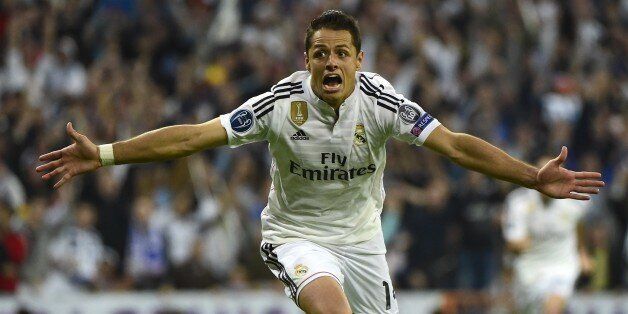 Real Madrid's Mexican forward Javier Hernandez celebrates after scoring a goal during the UEFA Champions League quarter-finals second leg football match Real Madrid CF vs Club Atletico de Madrid at the Santiago Bernabeu stadium in Madrid on April 22, 2015. AFP PHOTO / PIERRE-PHILIPPE MARCOU (Photo credit should read PIERRE-PHILIPPE MARCOU/AFP/Getty Images)