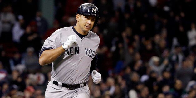 New York Yankees pinch hitter Alex Rodriguez runs to first after hitting a solo homer in the eighth inning of a baseball game against the Boston Red Sox at Fenway Park in Boston, Friday, May 1, 2015. Rodriguez has now tied slugger Willie Mays with 660 career home runs. (AP Photo/Elise Amendola)
