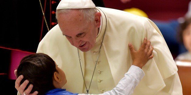 Pope Francis kisses a child during an audience at Paul VI audience hall on May 11, 2015 at the Vatican. AFP PHOTO / VINCENZO PINTO (Photo credit should read VINCENZO PINTO/AFP/Getty Images)