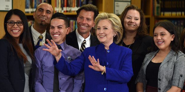 LAS VEGAS, NV - MAY 05: Democratic presidential candidate and former U.S. Secretary of State Hillary Clinton (C) poses with students and faculty after speaking at Rancho High School on May 5, 2015 in Las Vegas, Nevada. Clinton said that any immigration reform would need to include a path to 'full and equal citizenship.' (Photo by Ethan Miller/Getty Images)