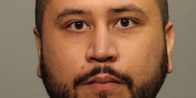SANFORD, FL - JANUARY 10: In this handout photo provided by Seminole County Sheriff`s Office, George Zimmerman poses for a mug shot photo after being arrested and booked into jail at the John Polk Correctional Facility January 9, 2015 in Sanford, Florida. Florida officials report that Zimmerman has been charged with aggravated assault and domestic violence with a weapon. (Photo by Seminole County Sheriff`s Office via Getty Images)