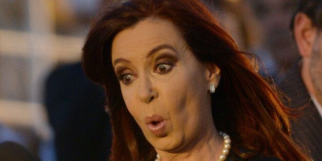 Argentina's President Cristina Fernandez de Kirchner gestures during a welcoming ceremony for Argentina's frigate Libertad, in Mar del Plata, 400km south of Buenos Aires, Argentina on January 9, 2013. The Libertad had been detained for two months in Ghana due to a debt the Argentine government holds with a financial fund since they defaulted during an economic crisis in 2001. AFP PHOTO/Leo LA VALLE (Photo credit should read LEO LA VALLE/AFP/Getty Images)