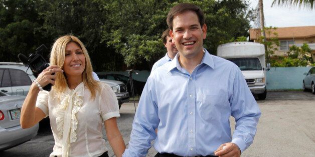 Marco Rubio, right, walks with his wife Jeanette, left, after voting in Florida's primary election in West Miami, Florida Tuesday, Aug. 24, 2010. Rubio is a Republican candidate for the U. S. Senate and will face democratic candidate Kendrick Meek and independent candidate Charlie Crist in the November general election. (AP Photo/Lynne Sladky)