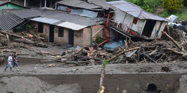 Houses damaged during an avalanche in Salgar, in Colombia's northwestern state of Antioquia, Tuesday, May 19, 2015. The avalanche of mud and debris roared through the mountain town before dawn Monday, taking away homes and bridges. Authorities said the death toll, which had risen to 62, was likely to grow throughout the day as an undetermined number of people remain missing. (AP Photo/Luis Benavides)