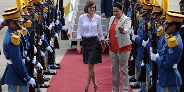 Queen of Spain Letizia Ortiz (L) is received by Honduran First Lady Ana de Hernandez at Palmerola air base, in Comayagua department, 80 km north of Tegucigalpa on May 25, 2015. Queen Letizia started Monday a two-day visit to Honduras to supervise Spanish cooperation programs in the country. AFP PHOTO / Orlando SIERRA (Photo credit should read ORLANDO SIERRA/AFP/Getty Images)