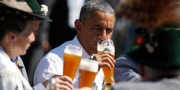 KRUEN, GERMANY - JUNE 07: U.S. President Barack Obama enjoys a beer in the morning of the summit of G7 nations on June 7, 2015 in Kruen, Germany. In the course of the two-day summit G7 leaders are scheduled to discuss global economic and security issues, as well as pressing global health-related issues, including antibiotics-resistant bacteria and Ebola. Several thousand protesters have announced they will seek to march towards Schloss Elmau and at least 17,000 police are on hand to provide security. (Photo by Goran Gajanin - Pool/Getty Images)