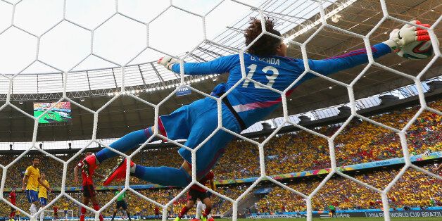 FORTALEZA, BRAZIL - JUNE 17: Guillermo Ochoa of Mexico dives to make a save during the 2014 FIFA World Cup Brazil Group A match between Brazil and Mexico at Castelao on June 17, 2014 in Fortaleza, Brazil. (Photo by Robert Cianflone/Getty Images)