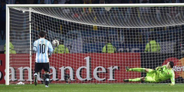 Argentina's forward Lionel Messi (L) scores a penalty kick past Colombia's goalkeeper David Ospina during the 2015 Copa America football championship quarterfinal match in Vina del Mar, Chile on June 26, 2015. AFP PHOTO / LUIS ACOSTA (Photo credit should read LUIS ACOSTA/AFP/Getty Images)