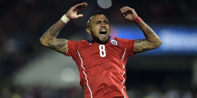 Chile's midfielder Arturo Vidal celebrates after scoring against Argentina during the penalty shootout of the 2015 Copa America football championship final, in Santiago, Chile, on July 4, 2015. AFP PHOTO / JUAN MABROMATA (Photo credit should read JUAN MABROMATA/AFP/Getty Images)