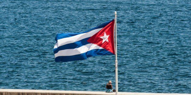 A Cuban national flag flutters as participants of the Havana Challenge regatta compete in Havana on May 19, 2015. The Havana Challenge is the first regatta authorized by the US since 2004 and the first to be held after the announcement of the process of normalization of relations between Cuba and the United States. AFP PHOTO / YAMIL LAGE (Photo credit should read YAMIL LAGE/AFP/Getty Images)
