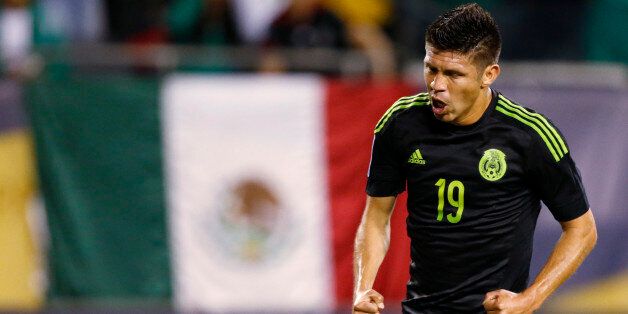 Mexico forward Oribe Peralta celebrates his goal against Cuba during the first half of a CONCACAF Gold Cup soccer match, Thursday, July 9, 2015, in Chicago. (AP Photo/Andrew A. Nelles)