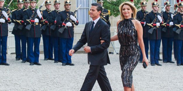 Mexican President Enrique Pena Nieto and his wife Angelica Rivera arrive prior to a dinner at the Elysee Palace in Paris, France, Thursday, July 16, 2015. The Mexican President is on a four-day state visit to France.(AP Photo/Kamil Zihnioglu)